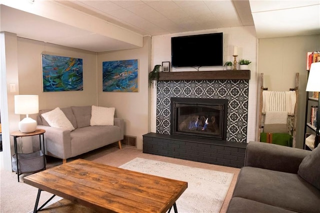 2702 Clark Pl, Eau Claire, WI 54701 - living area with a glass covered fireplace and carpet flooring