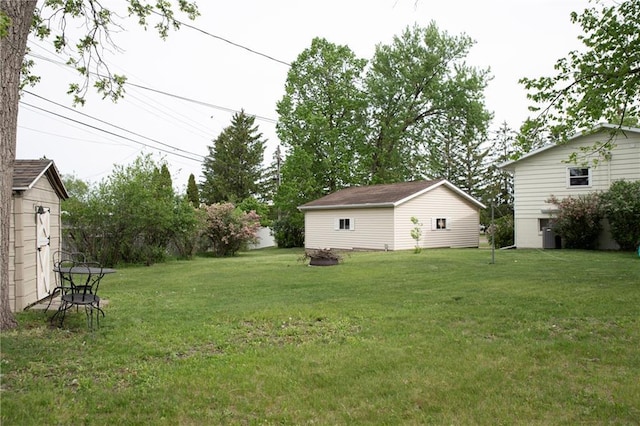 2702 Clark Pl, Eau Claire, WI 54701 - view of green lawn featuring an outdoor structure