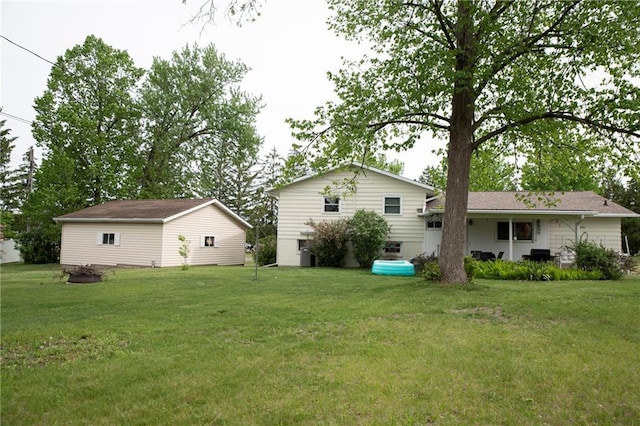 2702 Clark Pl, Eau Claire, WI 54701 - back of property featuring a lawn