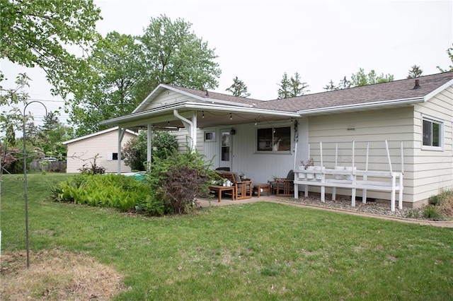 2702 Clark Pl, Eau Claire, WI 54701 - back of house with a lawn