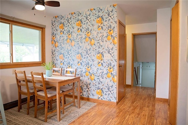 2702 Clark Pl, Eau Claire, WI 54701 - dining space featuring baseboards, light wood finished floors, wallpapered walls, and a ceiling fan