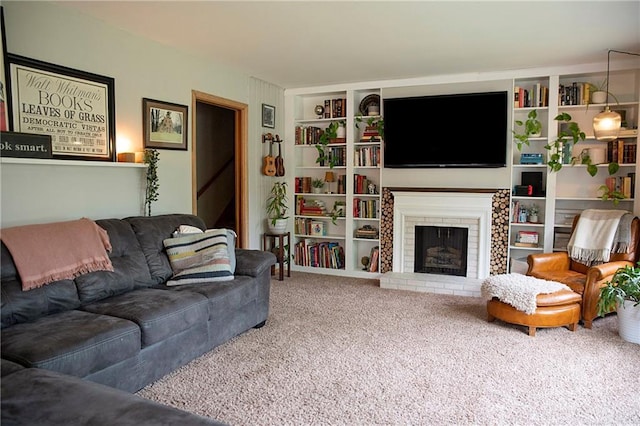 2702 Clark Pl, Eau Claire, WI 54701 - living area with carpet, a brick fireplace, and built in shelves