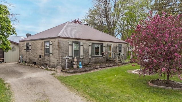 W8749 Hunters Rd, Hortonville, WI 54944 - view of front of property with stone siding, a front yard, and metal roof