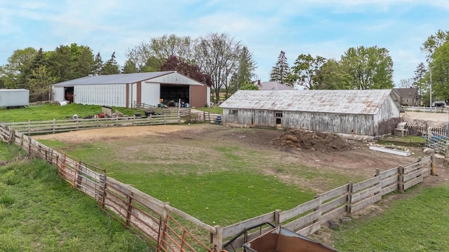 W8749 Hunters Rd, Hortonville, WI 54944 - view of grassy yard with an outbuilding, a detached garage, and an exterior structure