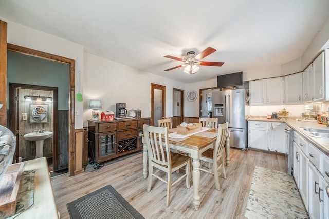W8749 Hunters Rd, Hortonville, WI 54944 - dining room featuring light wood-style flooring and a ceiling fan