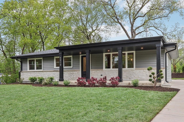 6020 Briarclift Ct, Greendale, WI 53129 - view of front of property with a front lawn, stone siding, and covered porch