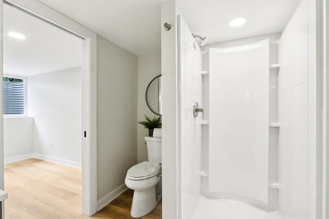 6020 Briarclift Ct, Greendale, WI 53129 - full bathroom featuring walk in shower, wood finished floors, baseboards, and toilet