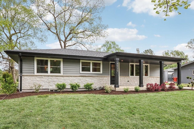 6020 Briarclift Ct, Greendale, WI 53129 - view of front facade with stone siding, a front lawn, and covered porch