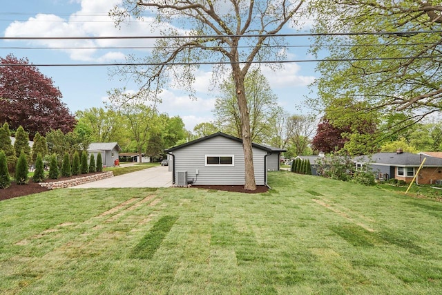 6020 Briarclift Ct, Greendale, WI 53129 - view of grassy yard featuring driveway and an outdoor structure