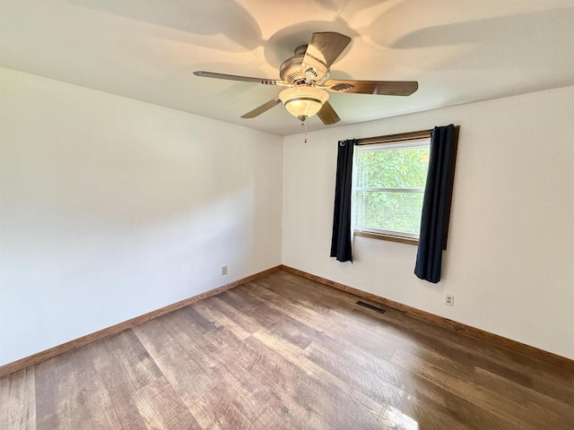 519 Rogers St, Milton, WI 53563 - empty room featuring wood finished floors, baseboards, and ceiling fan