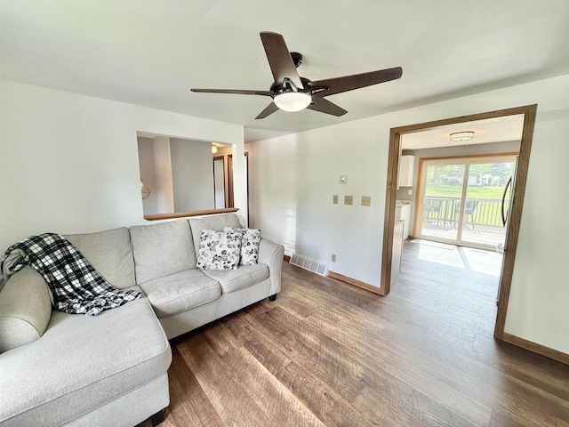 519 Rogers St, Milton, WI 53563 - living room with baseboards, a ceiling fan, and wood finished floors