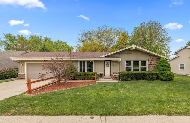 1127 Rainbow Ct, Mukwonago, WI 53149 - ranch-style home with driveway, brick siding, a garage, a front yard, and board and batten siding