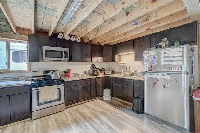 17690 Clayton Ave, Rosemount, MN 55068 - kitchen with appliances with stainless steel finishes, a sink, light wood-style flooring, and dark brown cabinets