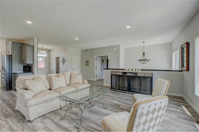 17690 Clayton Ave, Rosemount, MN 55068 - living area featuring a chandelier, light wood-style flooring, baseboards, and recessed lighting