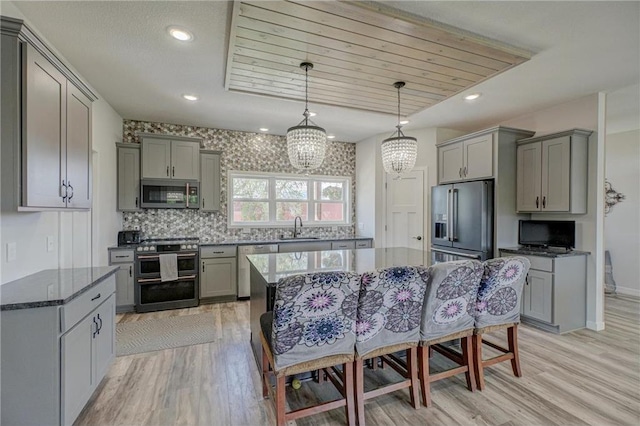 17690 Clayton Ave, Rosemount, MN 55068 - kitchen featuring appliances with stainless steel finishes, gray cabinets, a sink, a chandelier, and recessed lighting