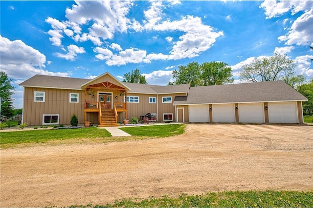 17690 Clayton Ave, Rosemount, MN 55068 - view of front of house featuring board and batten siding, dirt driveway, stairway, and a front yard