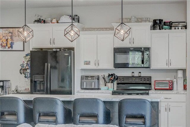 17690 Clayton Ave, Rosemount, MN 55068 - kitchen featuring black appliances, light countertops, white cabinets, and pendant lighting