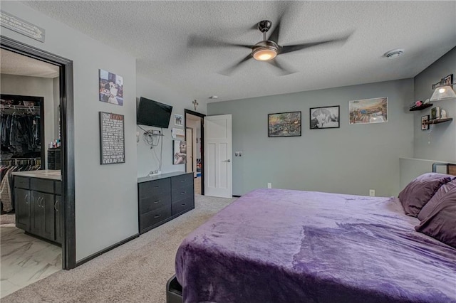 17690 Clayton Ave, Rosemount, MN 55068 - bedroom with a textured ceiling, a spacious closet, and a ceiling fan