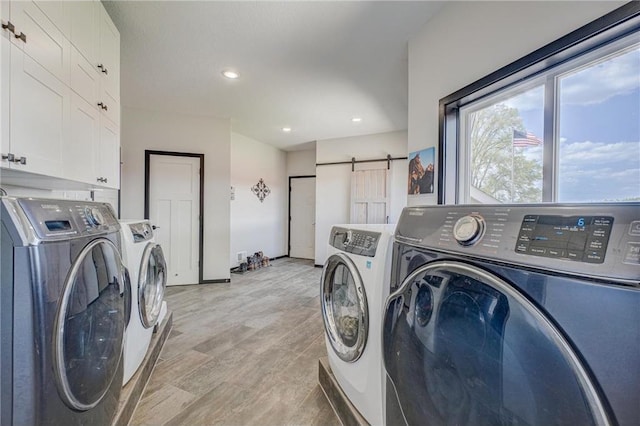 17690 Clayton Ave, Rosemount, MN 55068 - washroom with washer and clothes dryer, cabinet space, a barn door, recessed lighting, and baseboards