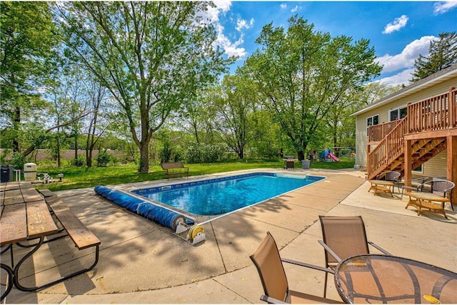 17690 Clayton Ave, Rosemount, MN 55068 - view of pool with a patio, a covered pool, stairs, a deck, and a lawn