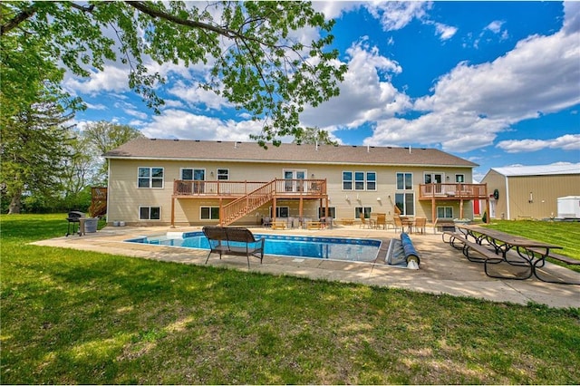 17690 Clayton Ave, Rosemount, MN 55068 - outdoor pool with stairway, a deck, a lawn, and a patio area