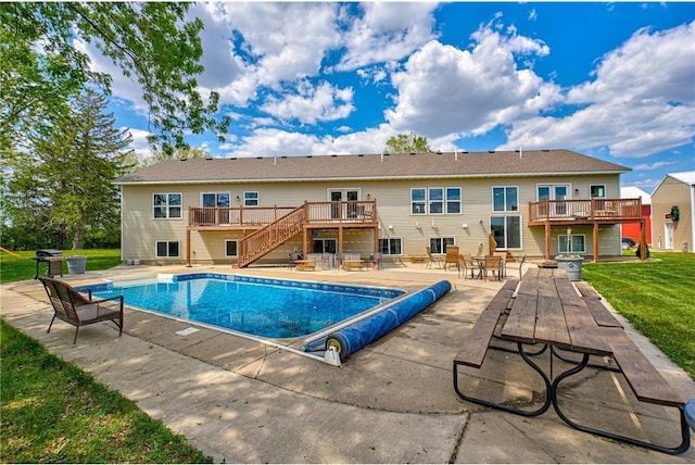 17690 Clayton Ave, Rosemount, MN 55068 - view of swimming pool featuring stairs, a deck, a patio area, and a covered pool