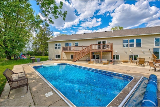 17690 Clayton Ave, Rosemount, MN 55068 - view of swimming pool featuring a deck, stairway, a patio area, and a covered pool
