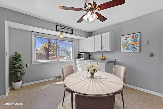 4415 S 5th St, Milwaukee, WI 53207 - dining space featuring baseboards and ceiling fan