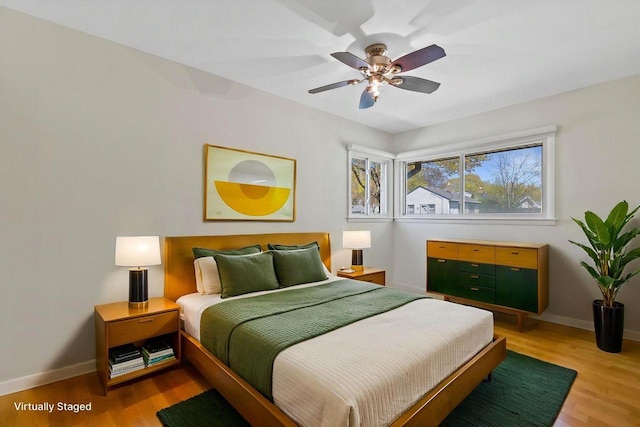 4415 S 5th St, Milwaukee, WI 53207 - bedroom featuring light wood finished floors, baseboards, and a ceiling fan