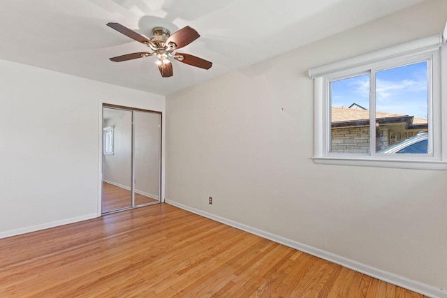 4415 S 5th St, Milwaukee, WI 53207 - unfurnished bedroom with baseboards, light wood-type flooring, and a closet