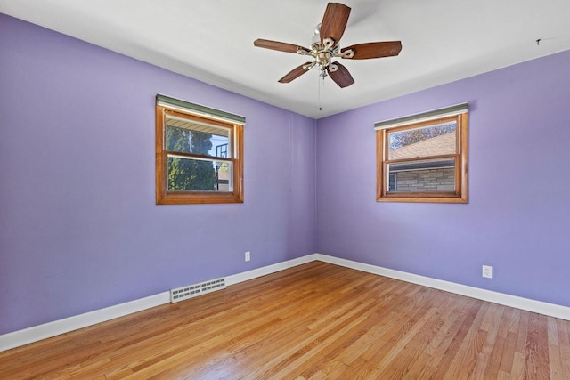 4415 S 5th St, Milwaukee, WI 53207 - spare room featuring baseboards, light wood-style floors, and a ceiling fan