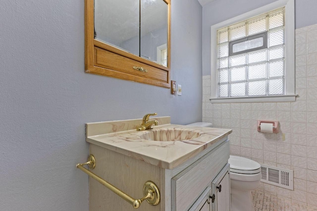 4415 S 5th St, Milwaukee, WI 53207 - half bathroom with toilet, vanity, and tile walls