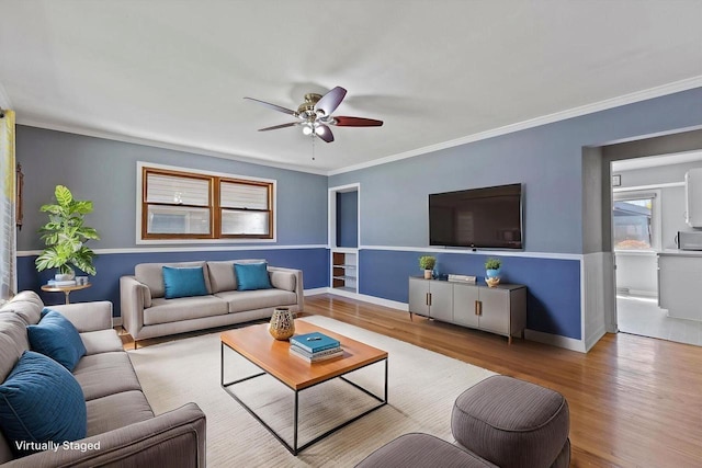 4415 S 5th St, Milwaukee, WI 53207 - living room with a ceiling fan, wood finished floors, ornamental molding, and baseboards