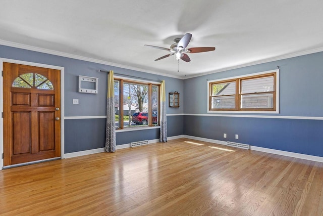 4415 S 5th St, Milwaukee, WI 53207 - entryway featuring a ceiling fan, wood finished floors, crown molding, and baseboards
