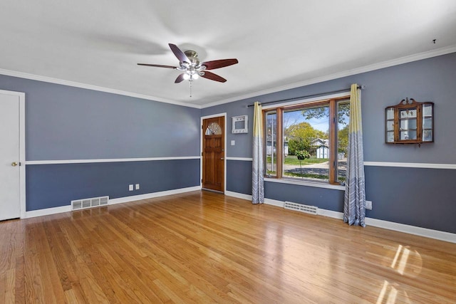 4415 S 5th St, Milwaukee, WI 53207 - spare room with a ceiling fan, wood finished floors, baseboards, and crown molding
