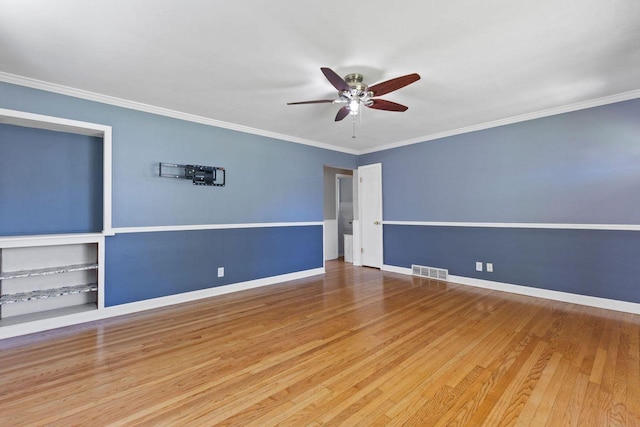 4415 S 5th St, Milwaukee, WI 53207 - spare room with a ceiling fan, wood finished floors, crown molding, and baseboards