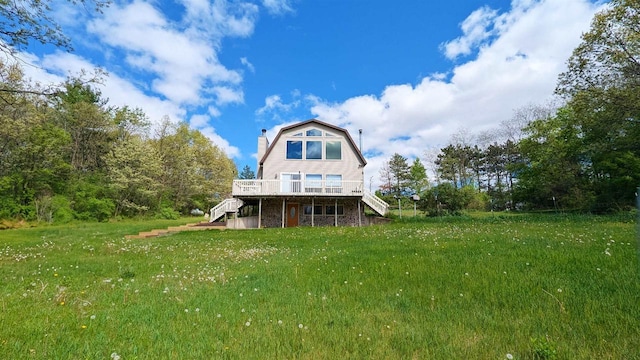 W11202 Apache Rd, Plainfield, WI 54966 - rear view of house featuring stairs, a deck, a gambrel roof, a yard, and a chimney