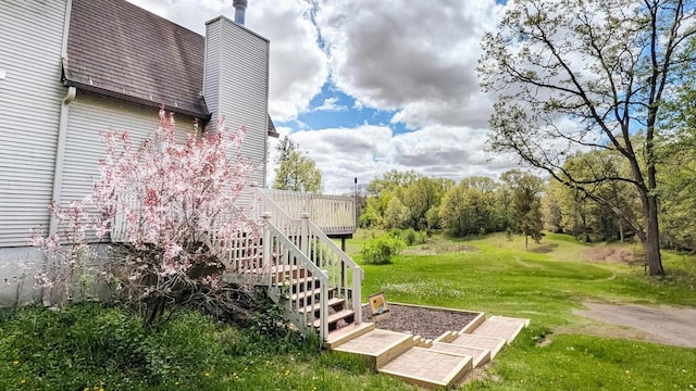 W11202 Apache Rd, Plainfield, WI 54966 - view of green lawn with a wooden deck and stairway