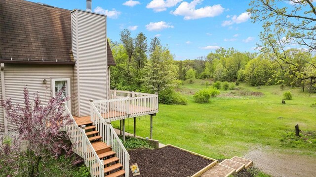 W11202 Apache Rd, Plainfield, WI 54966 - view of grassy yard with a wooden deck and stairs