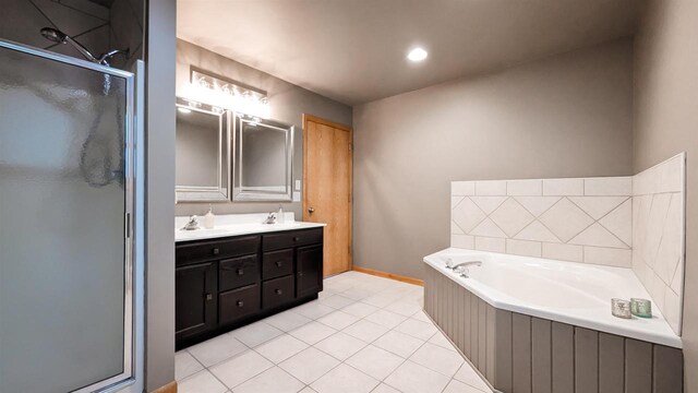 W11202 Apache Rd, Plainfield, WI 54966 - bathroom with a shower stall, a bath, double vanity, tile patterned flooring, and baseboards