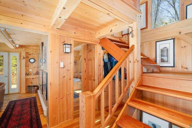 3610 N Shore Rd, La Pointe, WI 54850 - staircase with wood walls, wood ceiling with exposed beams, and wood finished floors
