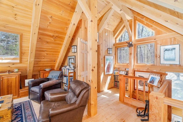 3610 N Shore Rd, La Pointe, WI 54850 - sitting room featuring light wood-type flooring, healthy amount of natural light, high vaulted ceiling, wooden ceiling with exposed beams, and wood walls
