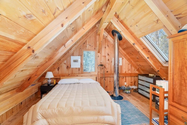 3610 N Shore Rd, La Pointe, WI 54850 - bedroom featuring wood ceiling, hardwood / wood-style flooring, wooden walls, and a skylight