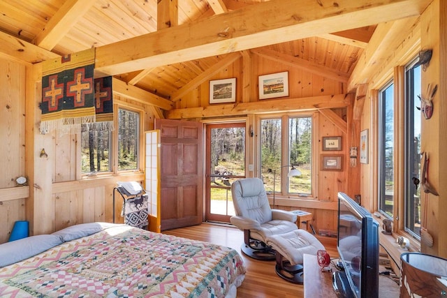 3610 N Shore Rd, La Pointe, WI 54850 - bedroom with wood walls, wood finished floors, multiple windows, access to outside, and wooden ceiling