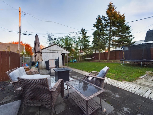 644 S 94th St, West Allis, WI 53214 - view of patio / terrace featuring a trampoline and an outdoor fire pit