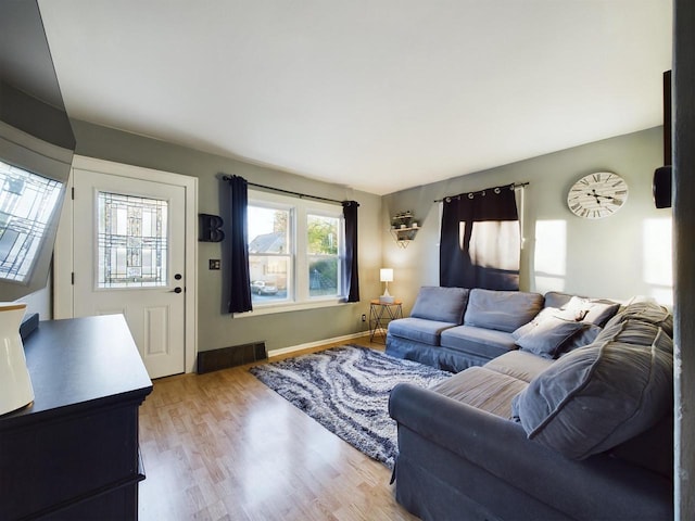 644 S 94th St, West Allis, WI 53214 - living area featuring light wood-type flooring and baseboards