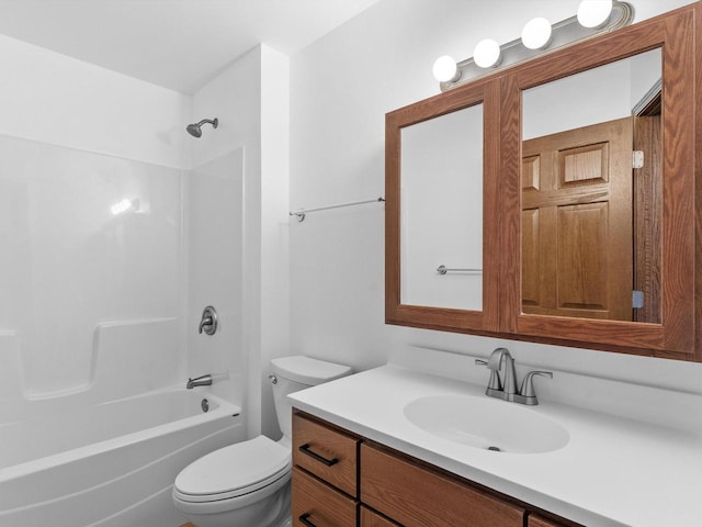 full bath featuring toilet, vanity, and shower / washtub combination