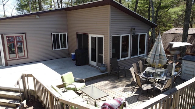 65485 Millicent Point Dr, Iron River, WI 54847 - back of house with outdoor dining space and a deck