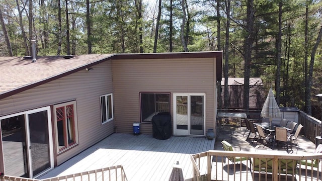 65485 Millicent Point Dr, Iron River, WI 54847 - wooden deck with outdoor dining area