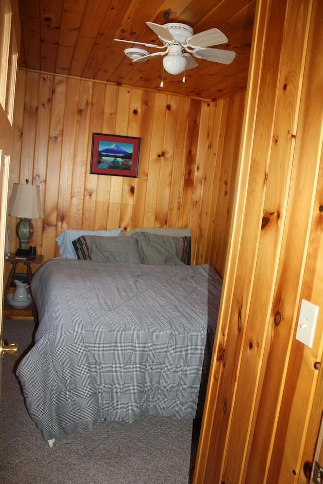 65485 Millicent Point Dr, Iron River, WI 54847 - carpeted bedroom with wood ceiling and wood walls